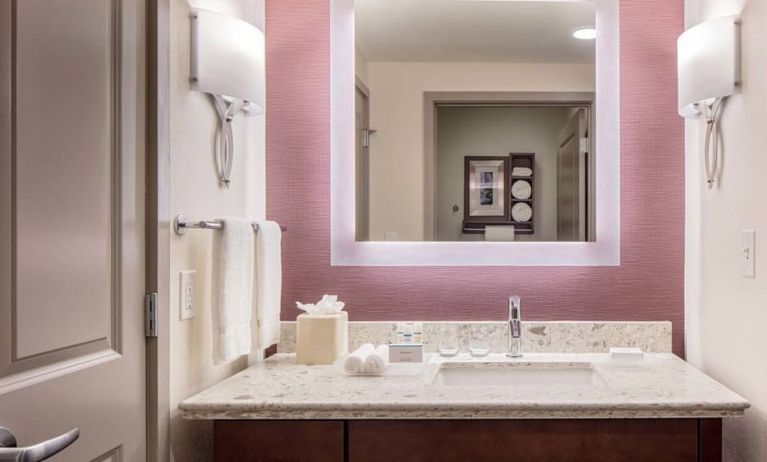 Private guest bathroom with shower at Homewood Suites By Hilton New Orleans French Quarter.