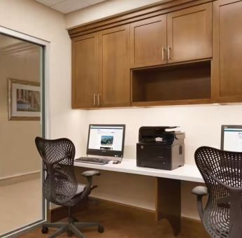 Dedicated business center with PC and printer at Hilton Garden Inn Boston Logan Airport.