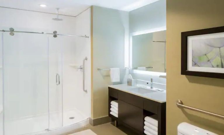 Private guest bathroom with shower at The Hollis Halifax - A DoubleTree Suites By Hilton.