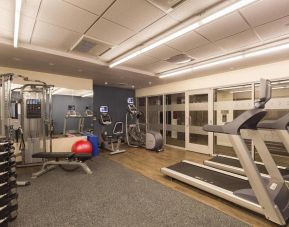 Hotel fitness center, with weights, treadmills, and other exercise equipment.