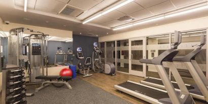 Hotel fitness center, with weights, treadmills, and other exercise equipment.