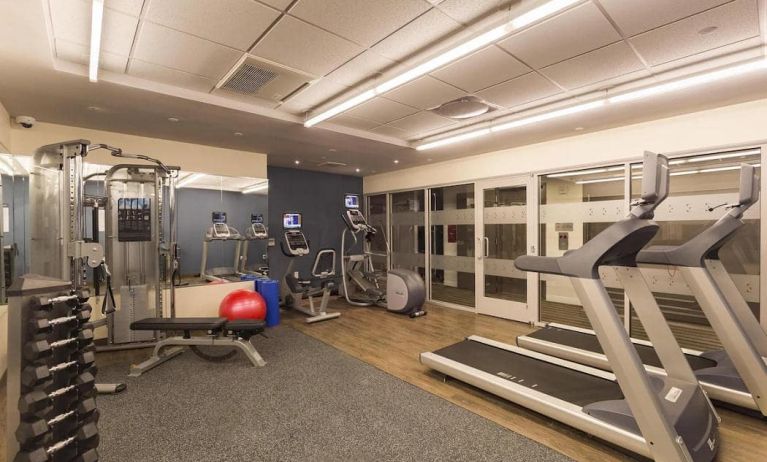 Hotel fitness center, with weights, treadmills, and other exercise equipment.