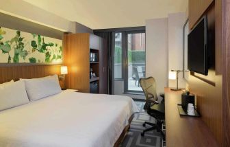 Double bed guest room at the Hilton Garden Inn New York Central Park South Mid-town West, with adjoining patio.