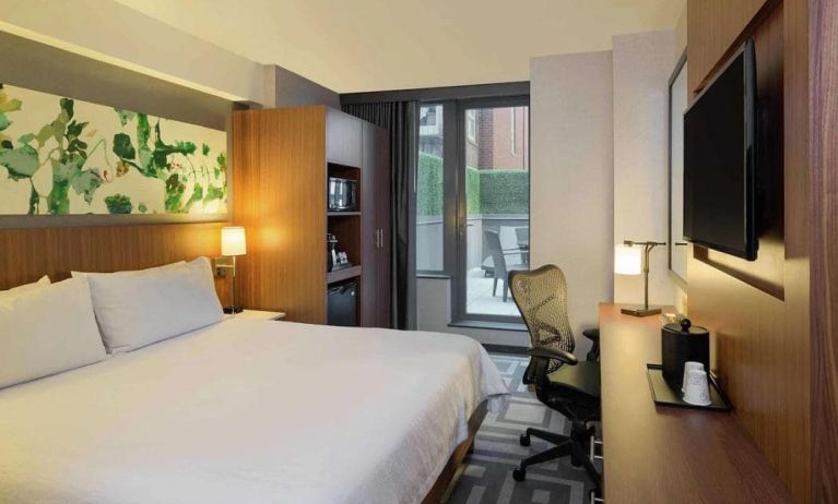 Double bed guest room at the Hilton Garden Inn New York Central Park South Mid-town West, with adjoining patio.