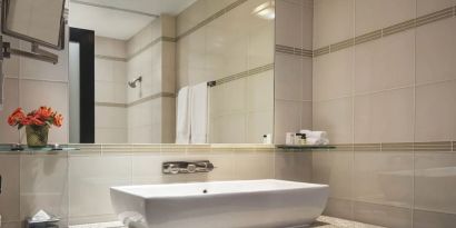 Private guest bathroom with shower at Royalton Park Avenue.