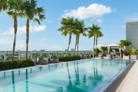 Relaxing pool area with sun chairs at The Altair Hotel Bay Harbor.