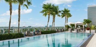 Relaxing pool area with sun chairs at The Altair Hotel Bay Harbor.