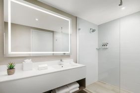 Private guest bathroom with shower at The Altair Hotel Bay Harbor.