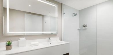 Private guest bathroom with shower at The Altair Hotel Bay Harbor.