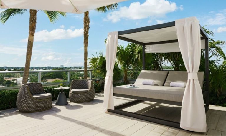 Relaxing cabanas available by the pool at The Altair Hotel Bay Harbor.