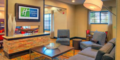 Lobby and coworking lounge at Holiday Inn Express Granbury.