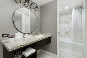 Private guest bathroom with bath and shower at Stanford Court San Francisco.