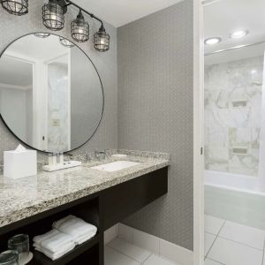 Private guest bathroom with bath and shower at Stanford Court San Francisco.