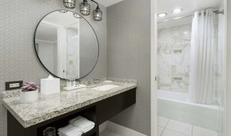 Private guest bathroom with bath and shower at Stanford Court San Francisco.