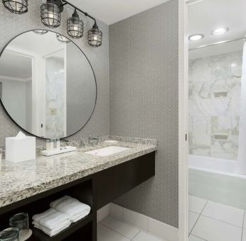 Private guest bathroom with bath and shower at Stanford Court San Francisco.