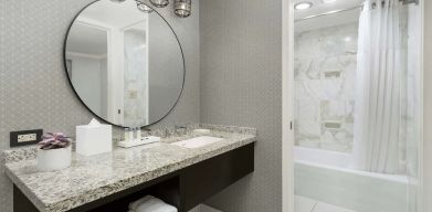 Private guest bathroom with bath and shower at Stanford Court San Francisco.