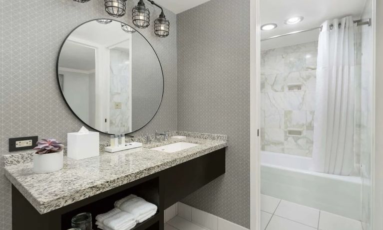 Private guest bathroom with bath and shower at Stanford Court San Francisco.