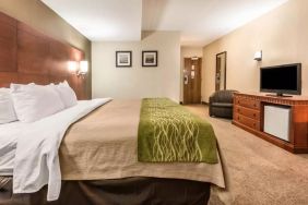 Spacious delux king bed with TV at Comfort Inn & Suites Barrie.