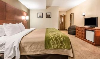 Spacious delux king bed with TV at Comfort Inn & Suites Barrie.