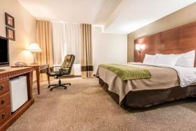 King bed with work desk at Comfort Inn & Suites Barrie.