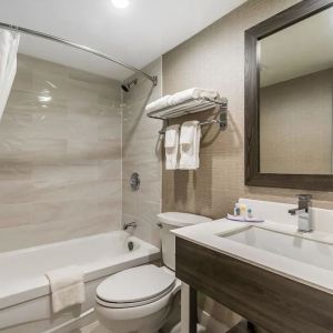 Private guest bathroom with shower and bath at Comfort Inn & Suites Barrie.