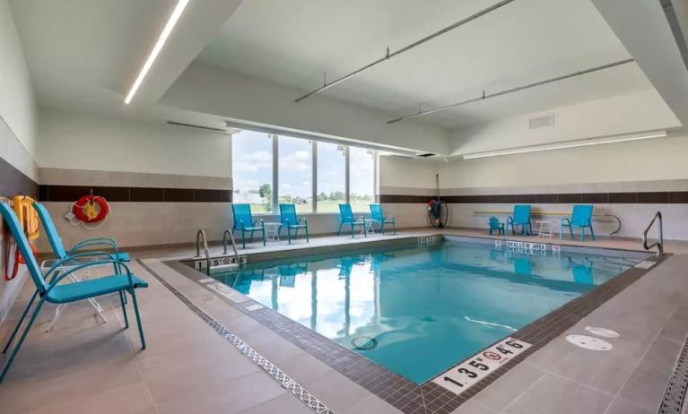 Relaxing indoor pool with seating area at Comfort Inn & Suites Napanee.