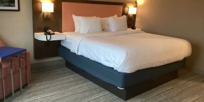 Comfortable delux king room with natural light at Hampton Inn By Hilton Port Hope.