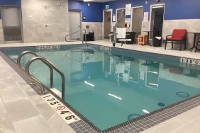 Relaxing indoor pool with seating area at Hampton Inn By Hilton Port Hope.