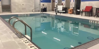 Relaxing indoor pool with seating area at Hampton Inn By Hilton Port Hope.