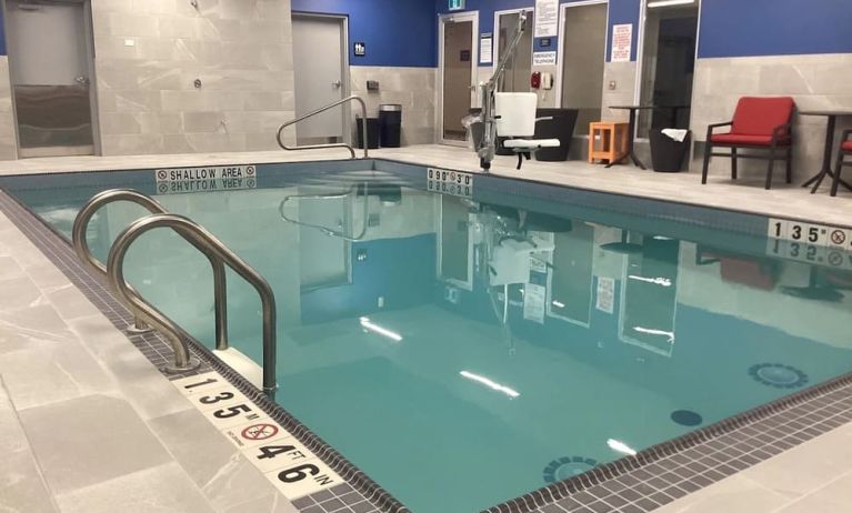 Relaxing indoor pool with seating area at Hampton Inn By Hilton Port Hope.