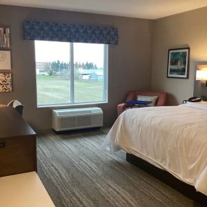 Spacious king bed with TV at Hampton Inn By Hilton Port Hope.