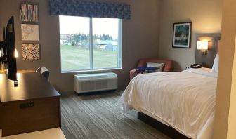 Spacious king bed with TV at Hampton Inn By Hilton Port Hope.