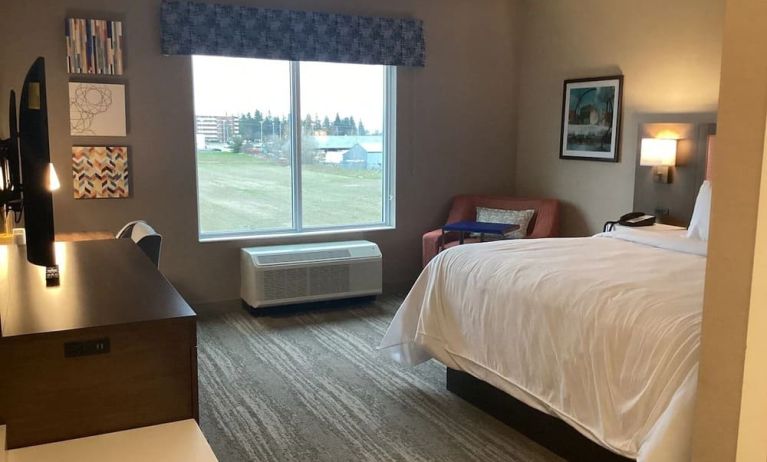 Spacious king bed with TV at Hampton Inn By Hilton Port Hope.