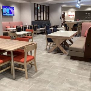 Dining and coworking space at Hampton Inn By Hilton Port Hope.