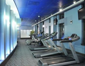 Well equipped fitness center with treadmills at Magnolia Dallas.
