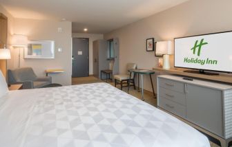 Delux king room with TV at Holiday Inn Edmonton South - Evario Events.