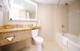 Private guest bathroom with shower and bath combo at Best Western Plus Ottawa/Kanata Hotel & Conf.