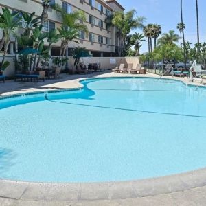 Stunning outdoor pool with pool chairs at Best Western San Diego Zoo/SeaWorld Inn & Suites.