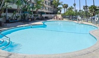 Stunning outdoor pool with pool chairs at Best Western San Diego Zoo/SeaWorld Inn & Suites.