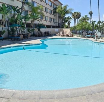 Stunning outdoor pool with pool chairs at Best Western San Diego Zoo/SeaWorld Inn & Suites.