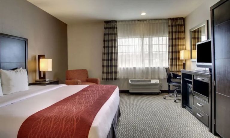 Spacious delux king room with TV and work desk at Best Western San Diego Zoo/SeaWorld Inn & Suites.