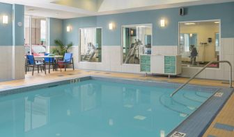 Large indoor pool with seating area at Holiday Inn Express North Bay.