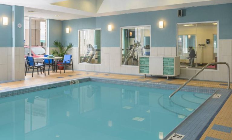 Large indoor pool with seating area at Holiday Inn Express North Bay.