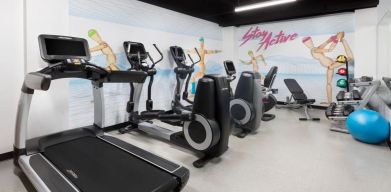 Well equipped fitness center at Hotel Studio Allston.