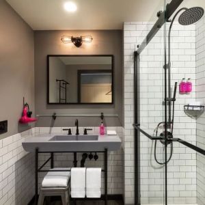 Private guest bathroom with shower at Moxy Boston Downtown.