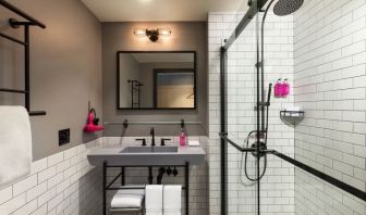 Private guest bathroom with shower at Moxy Boston Downtown.