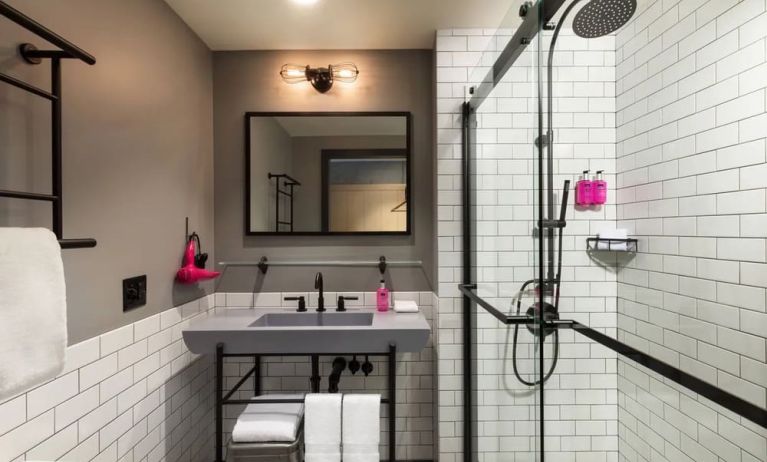 Private guest bathroom with shower at Moxy Boston Downtown.