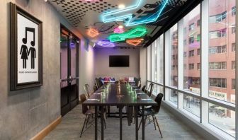 Professional and well-lit meeting room at Moxy Boston Downtown.