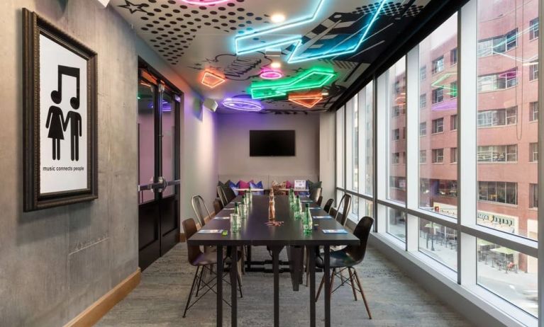 Professional and well-lit meeting room at Moxy Boston Downtown.