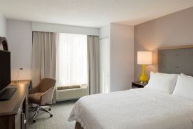 Delux king room with TV and work space at Hampton Inn Manhattan Chelsea.